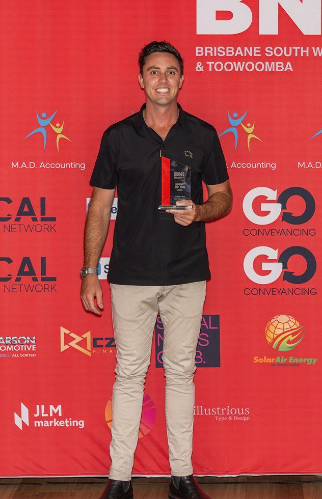 image of Nathan Bill holding trophy award
